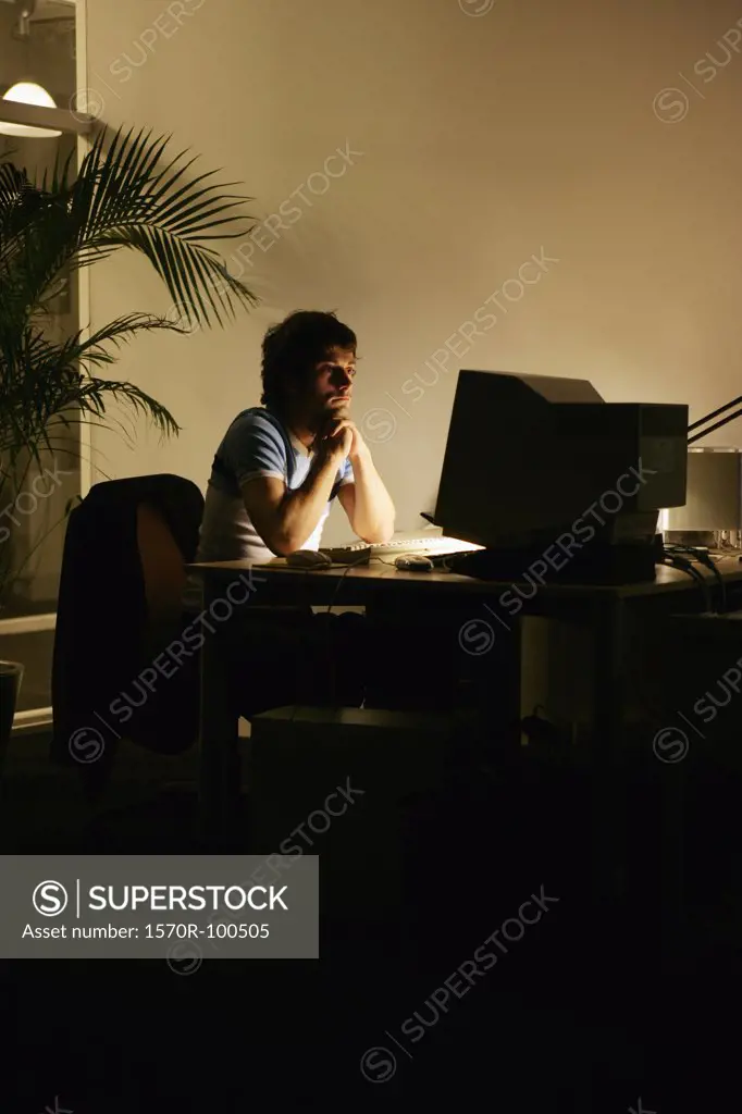 Man looking at computer monitor