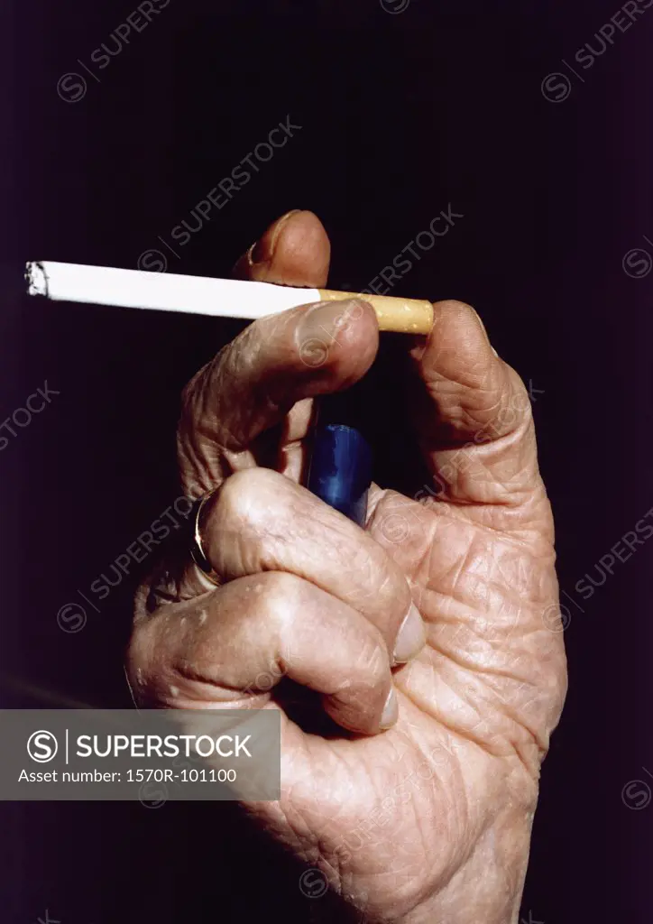 Senior man holding a cigarette