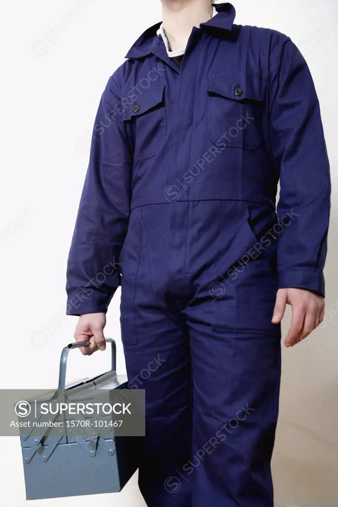 Midsection of a man holding a tool box