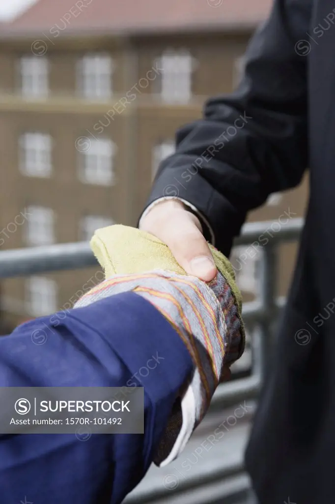 Close up of two men shaking hands