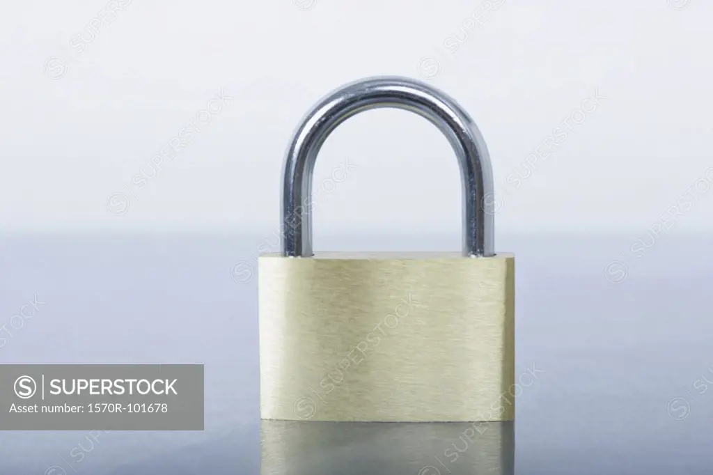 Front view of a small lock on a shiny surface