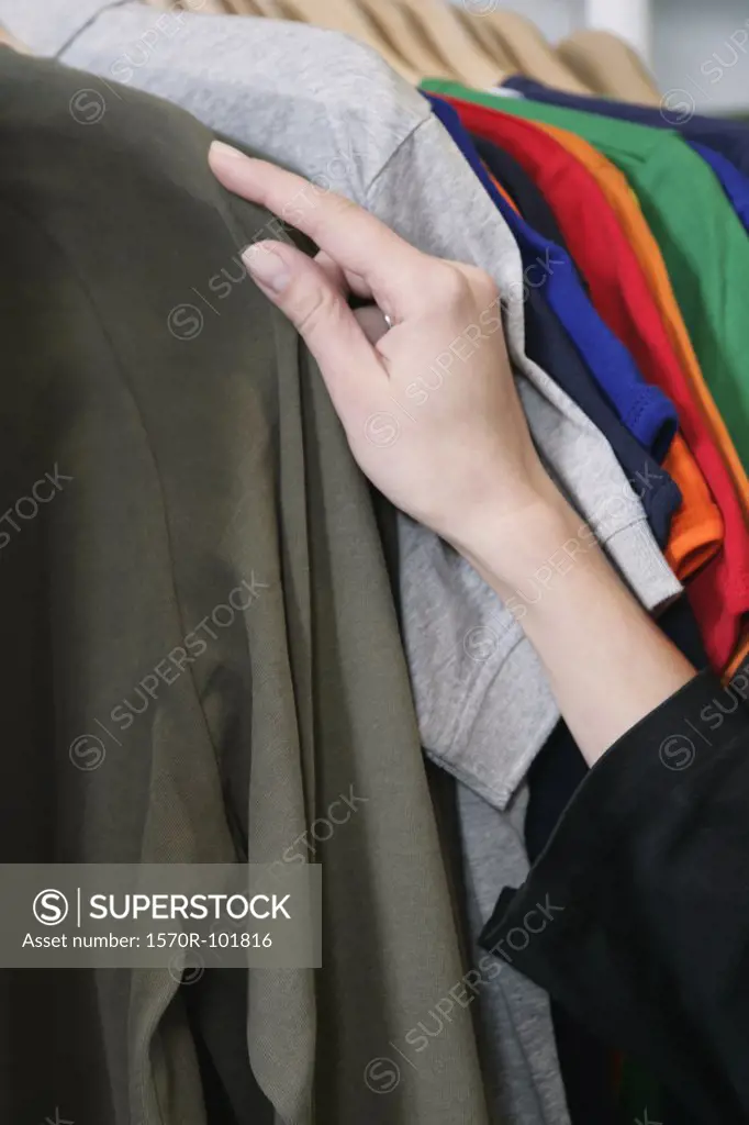 A woman shopping for a shirt