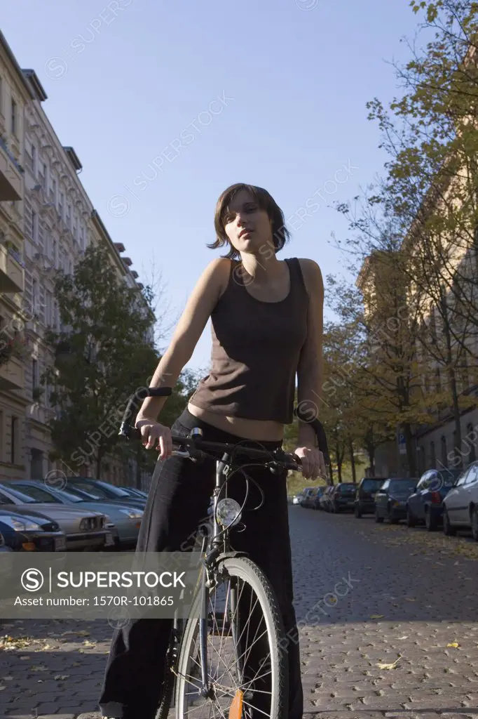 Front view of a young woman on her bicycle