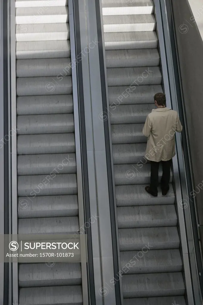 A man going up an escalator
