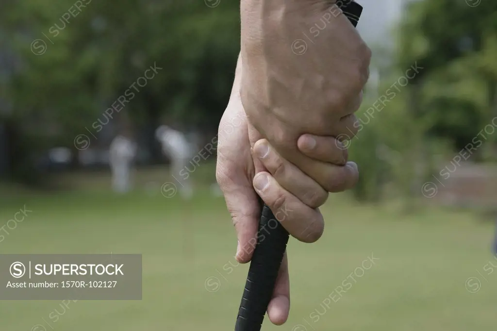 Close up of a golfer holding a club