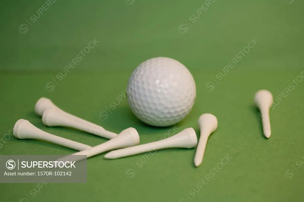 A golf ball with golf tees