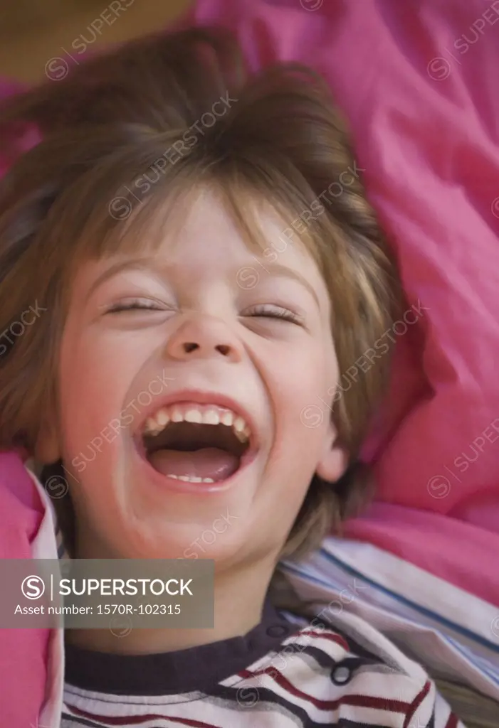 A young boy laughing