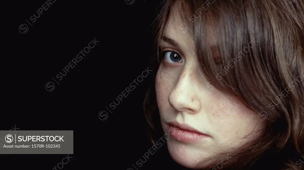 Close-up of young woman alone