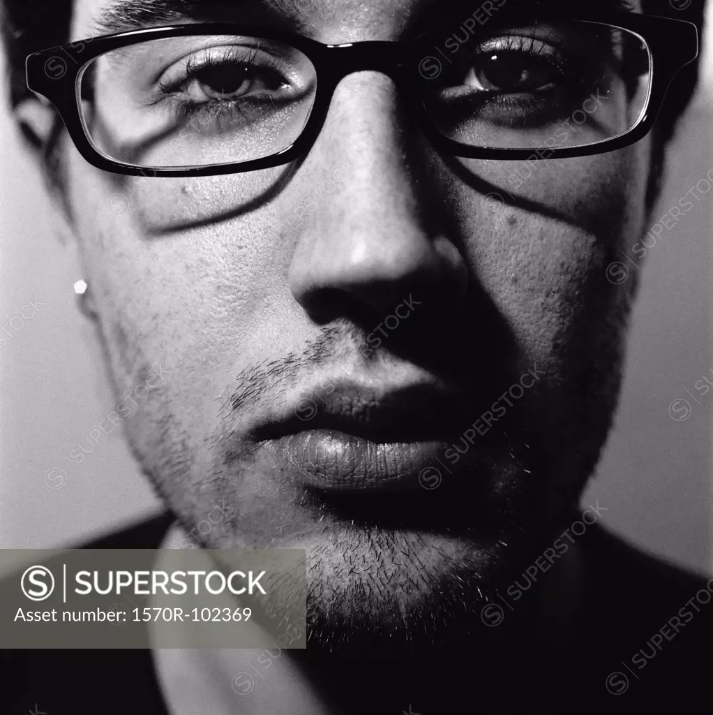Close up of young man with glasses