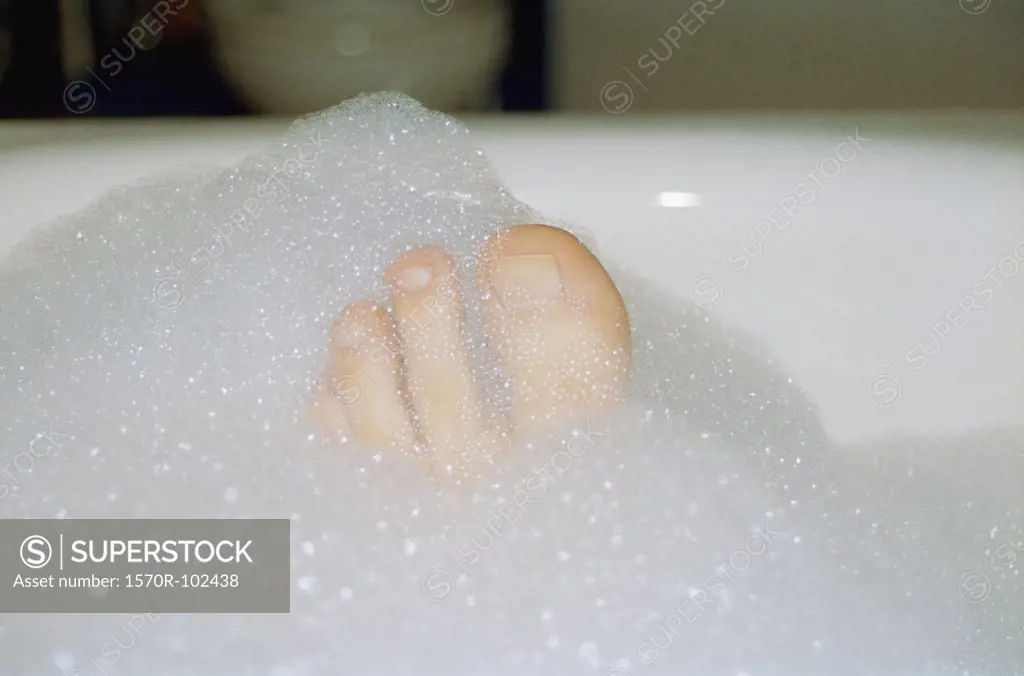 Toes poking out of bubble bath