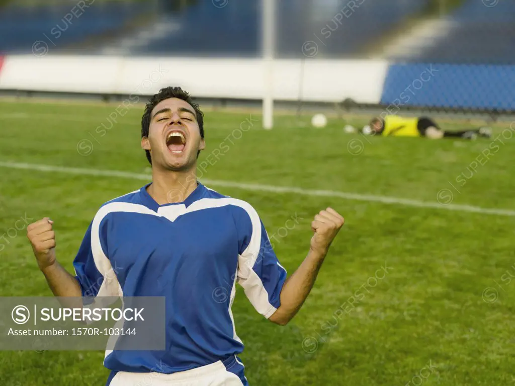 A soccer player celebrating a goal