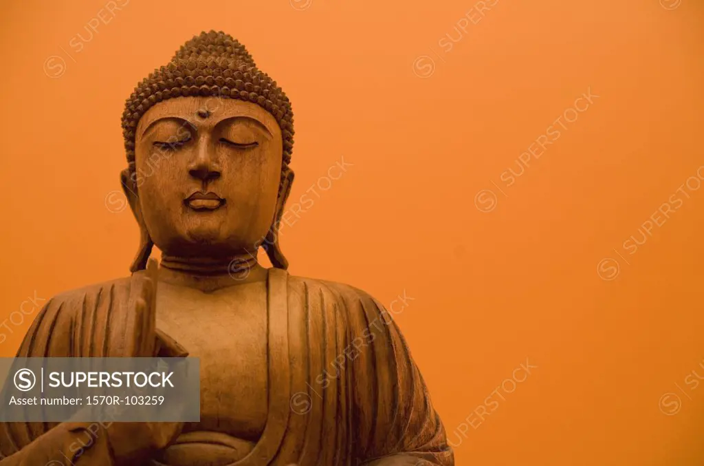 Wooden carving of Buddha