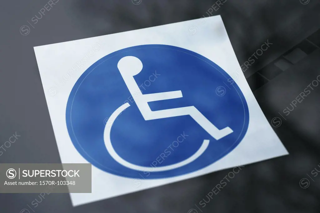 Disabled sticker on dashboard of car