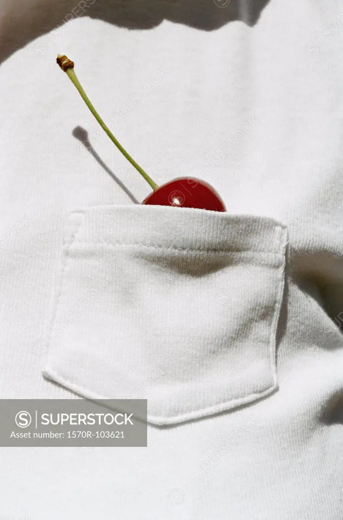 Man with a cherry in his shirt pocket