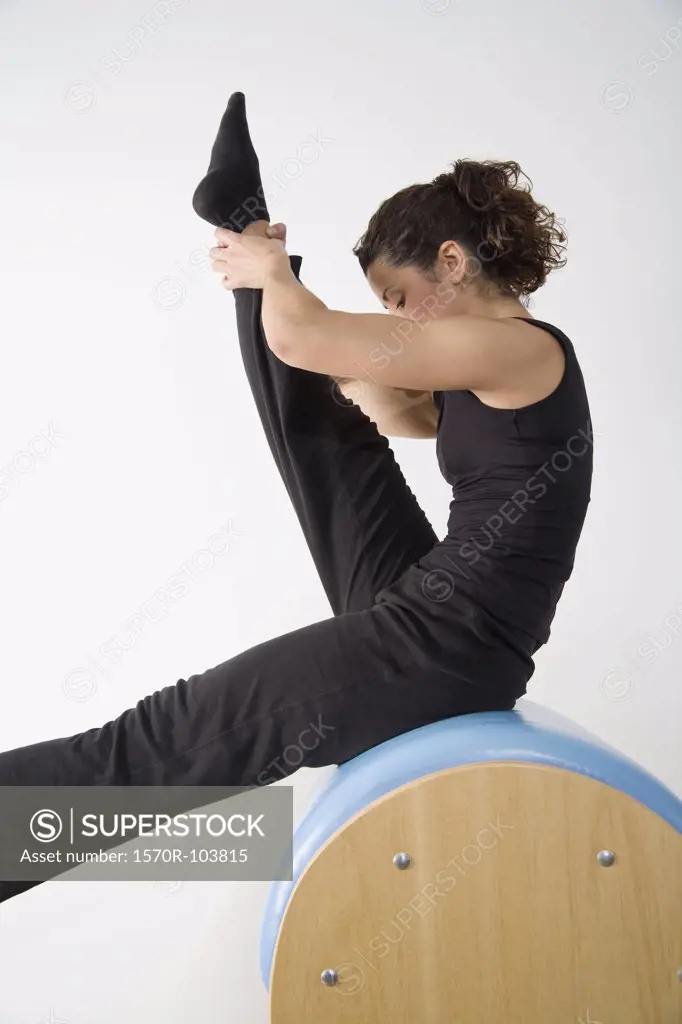 Woman exercising on pommel horse