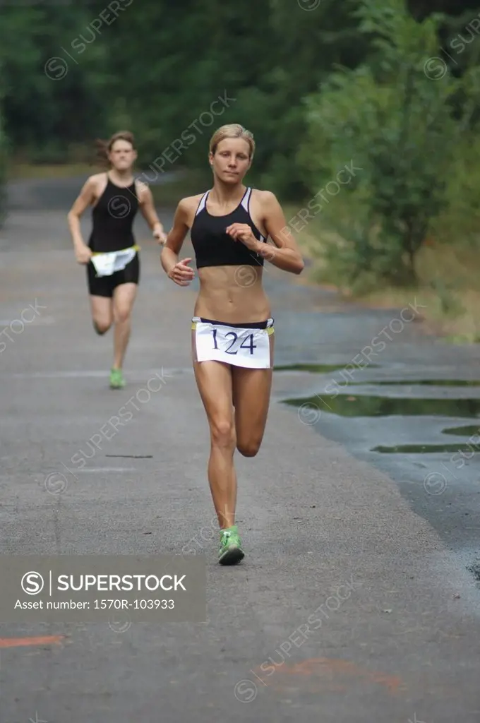 Young woman competing in triathlon