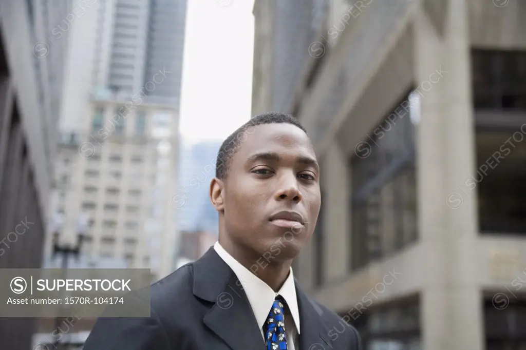 Young businessman standing in financial district