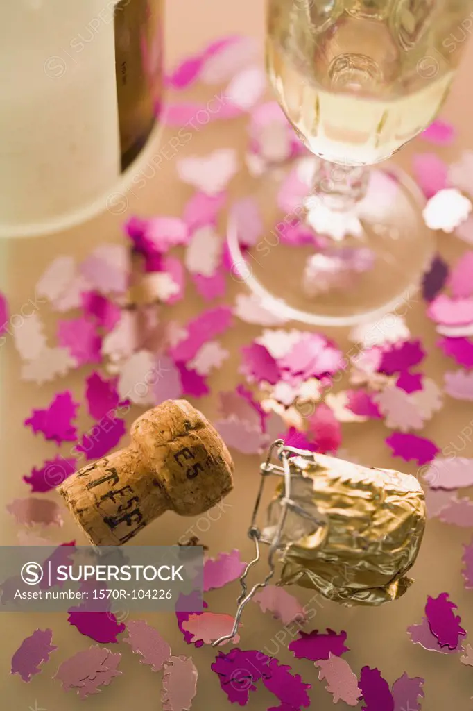 Part of table with champagne, cork and decoration