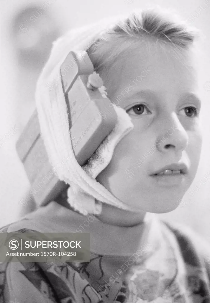Portrait of girl with bandage and ice pack