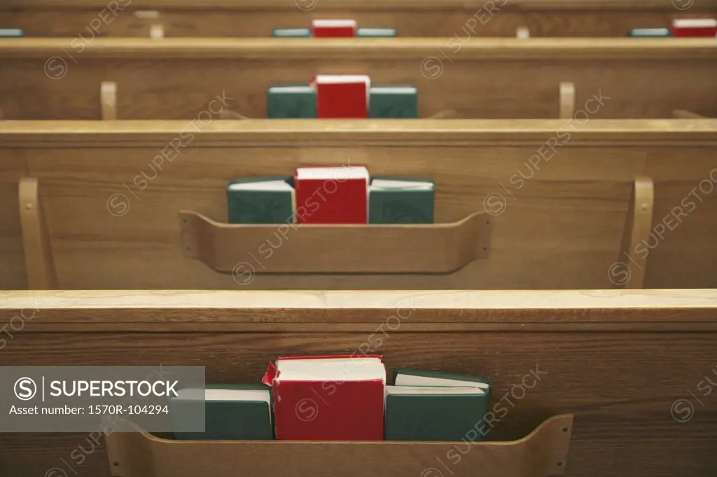 Empty church pews and hymnals
