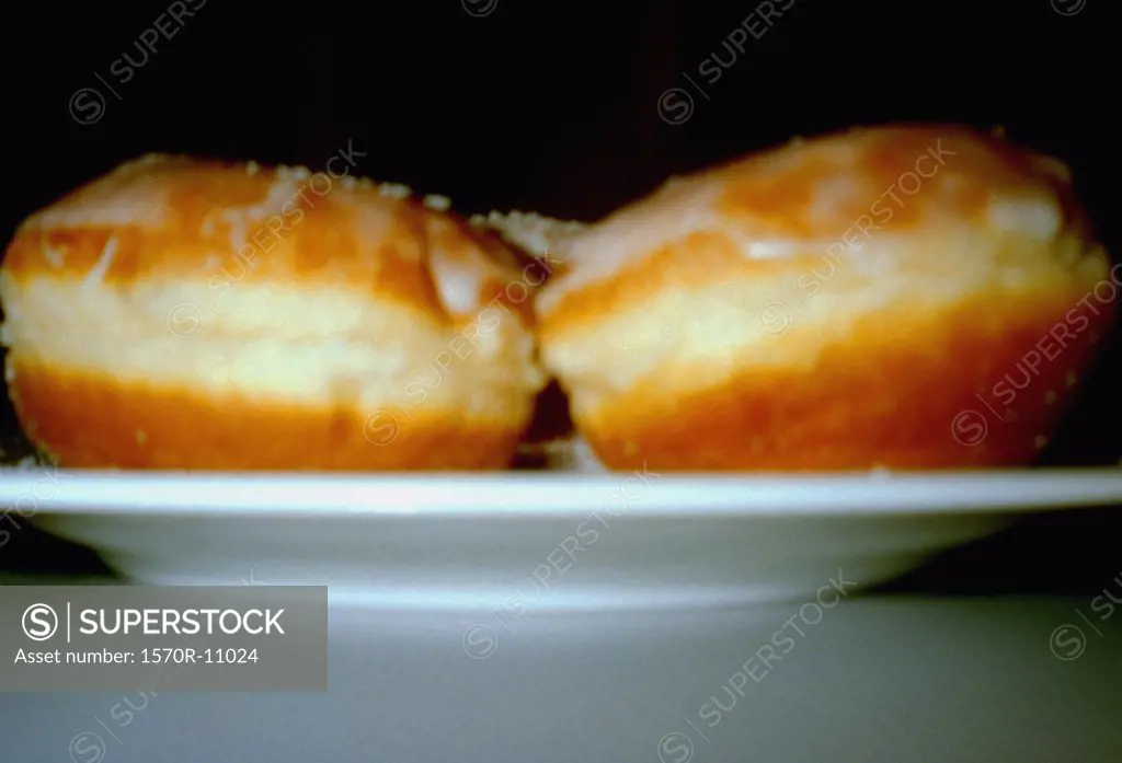 two doughnuts on a plate
