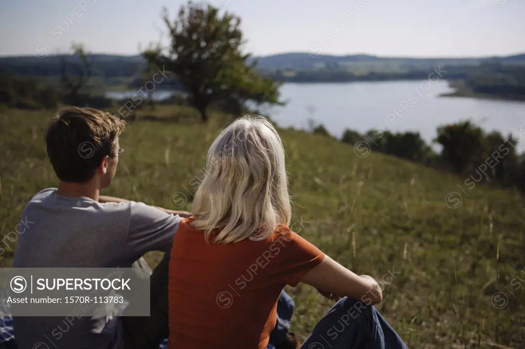 Couple sitting looking at view