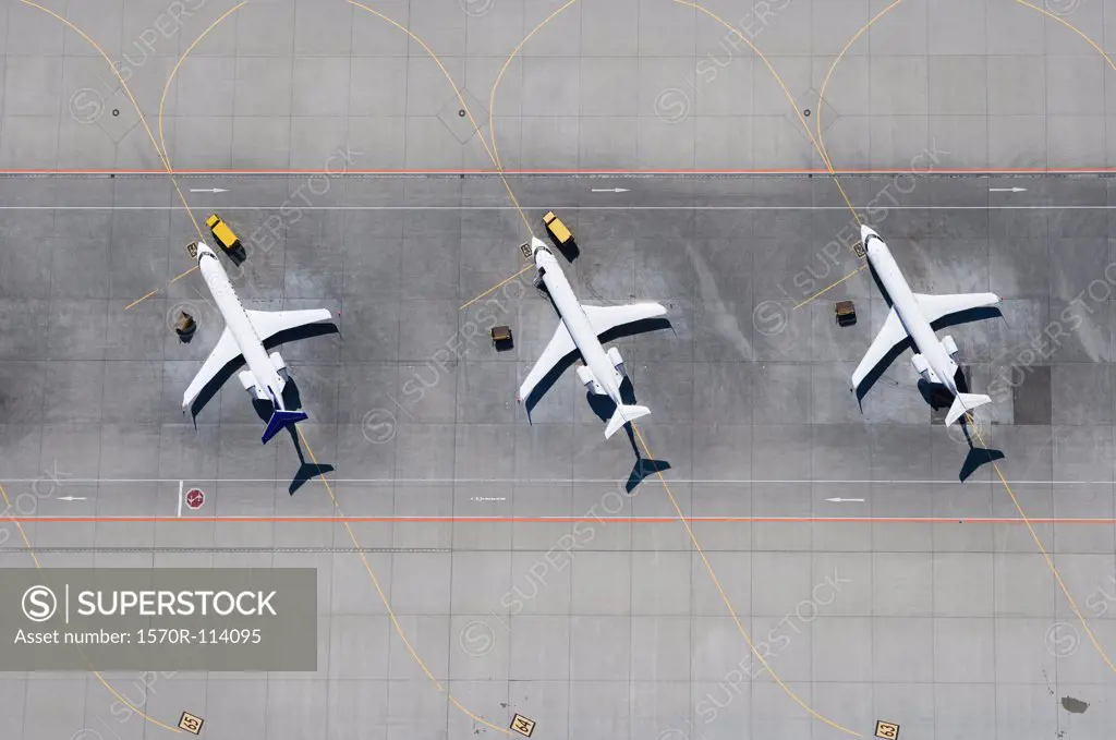 Aerial view of three airplanes in a row