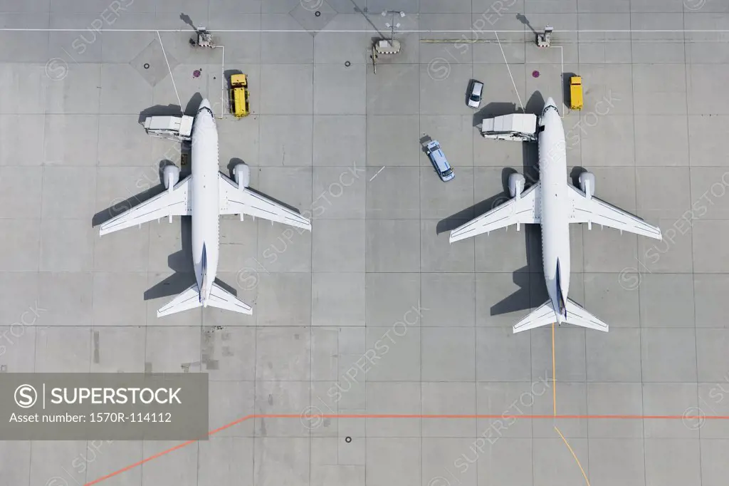 Aerial view of two airplanes on tarmac