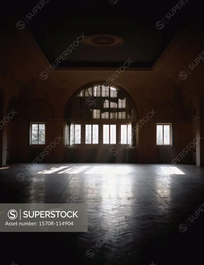 Sunbeams shining in empty ballroom