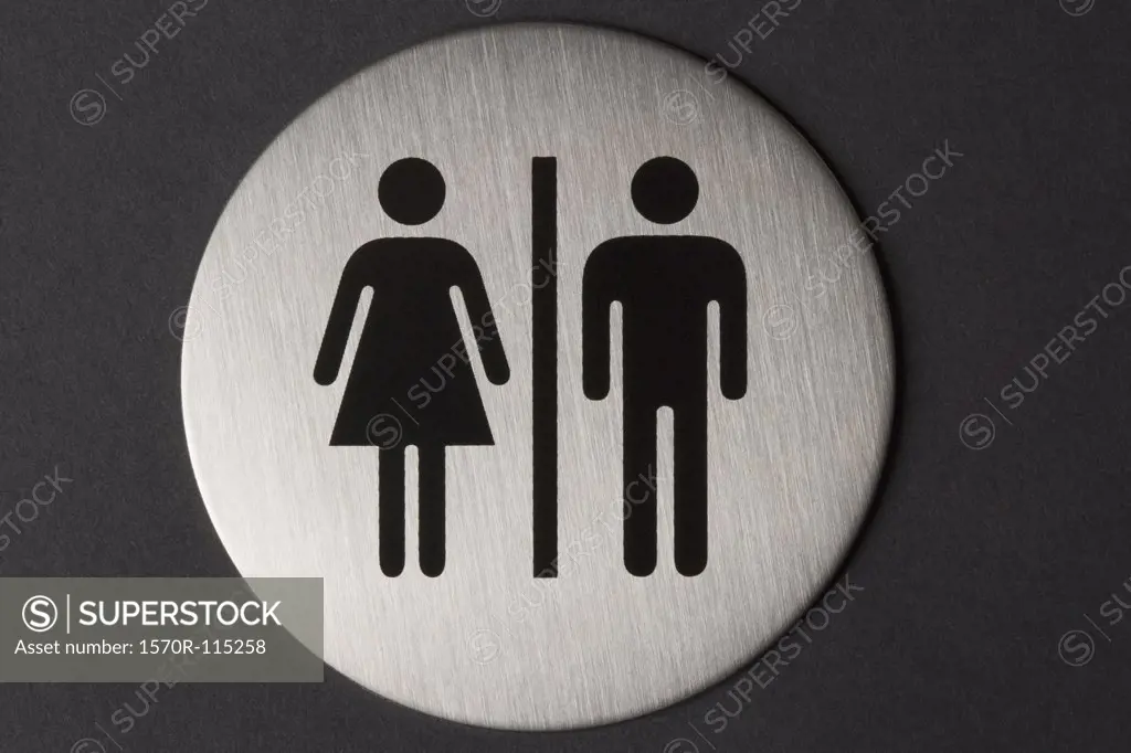 Female and male sign on toilet door