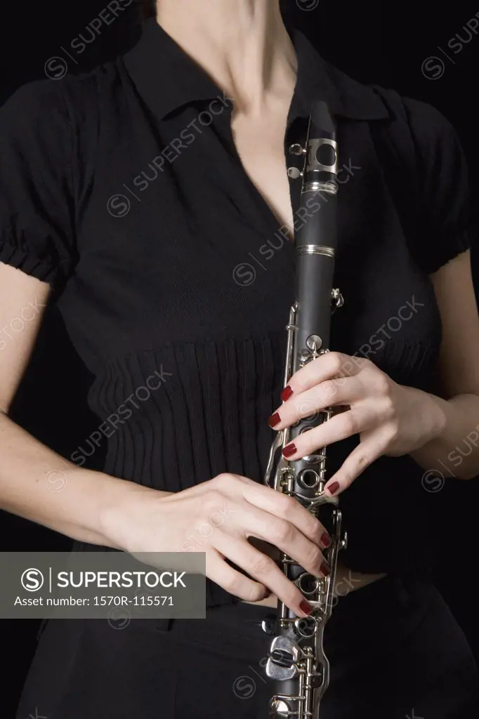 Woman holding a clarinet
