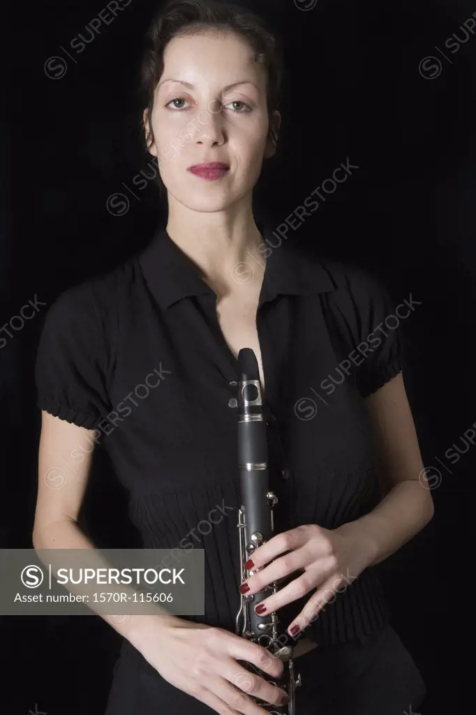 Woman holding a clarinet