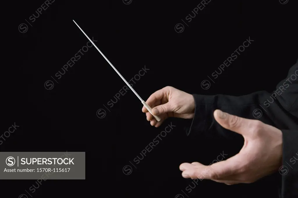 Conductor holding a baton