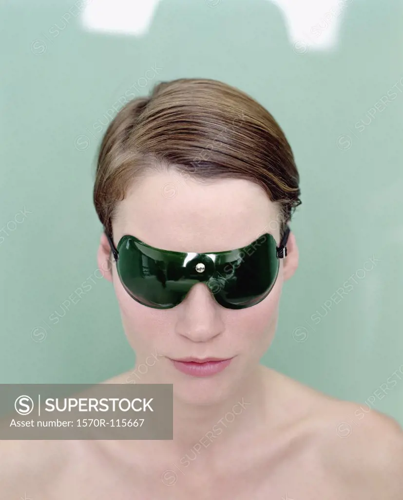 Woman wearing protective eyewear at beauty spa