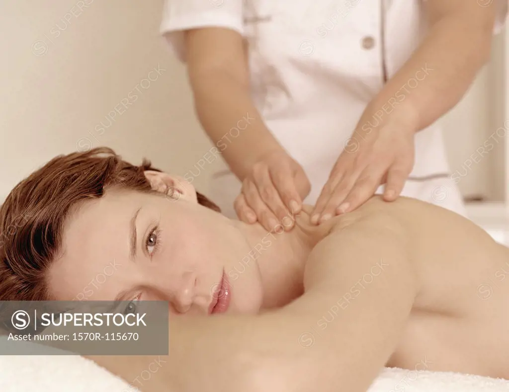 Woman receiving a massage at a beauty spa