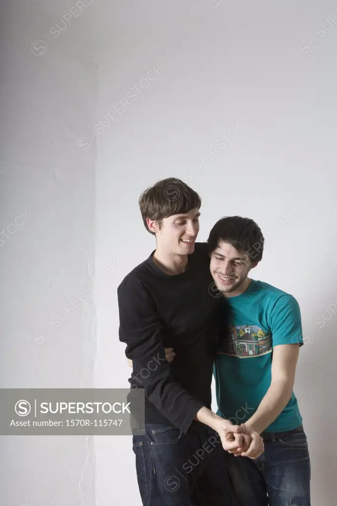 Young gay couple dancing together