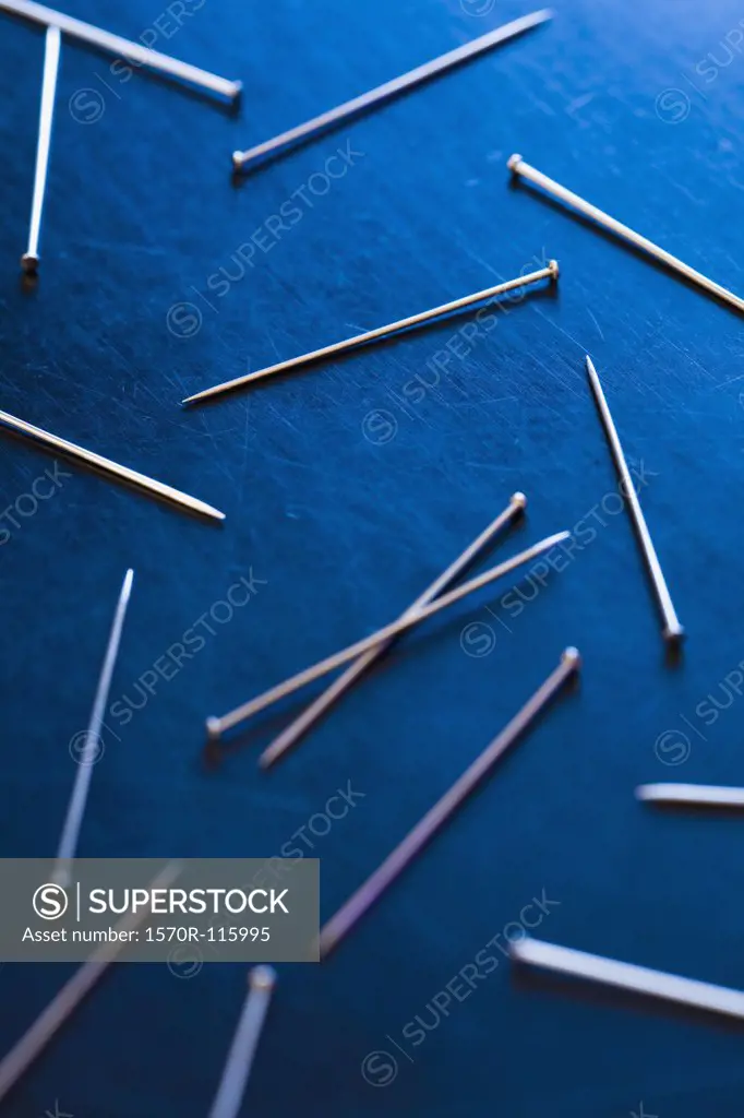 Silver pins on a desk