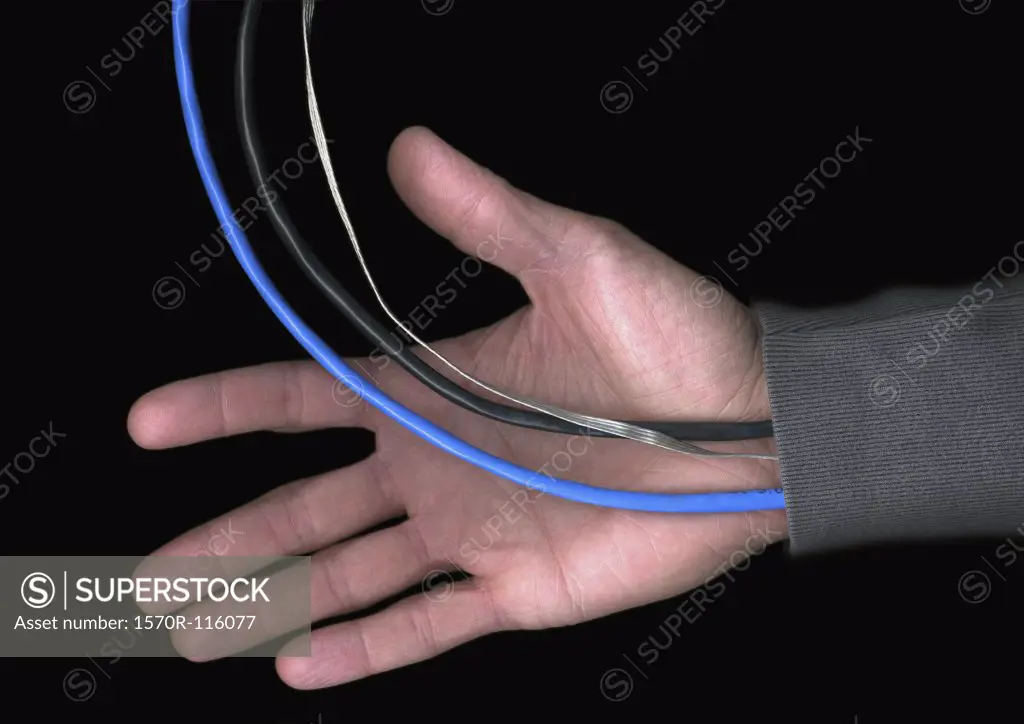 Man with cables and wires extending from his sleeve