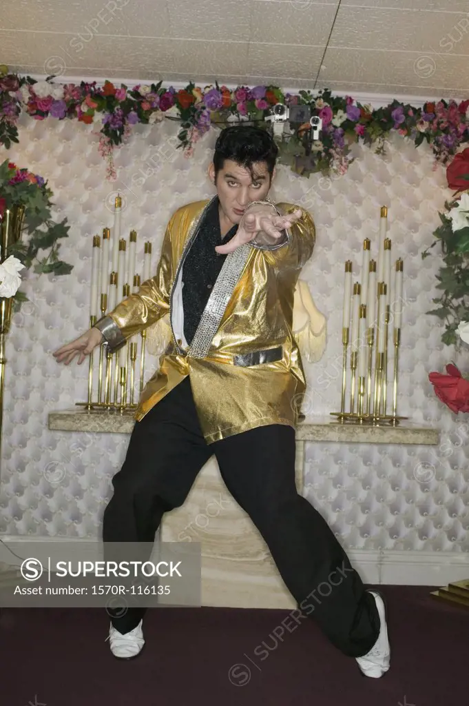 Elvis impersonator standing at the altar in a wedding chapel, Las Vegas, Nevada