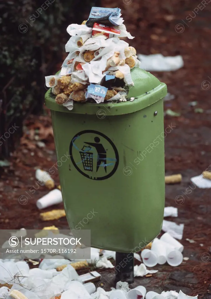 Garbage bin overflowing with trash