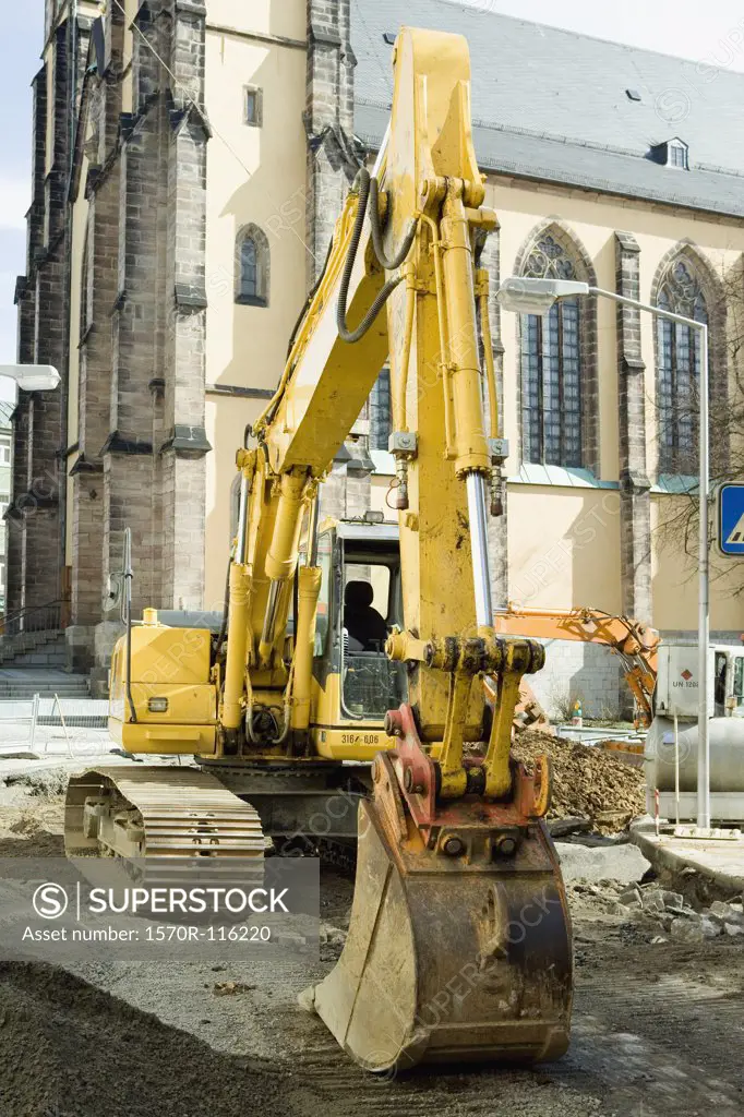 A digger outside of a church