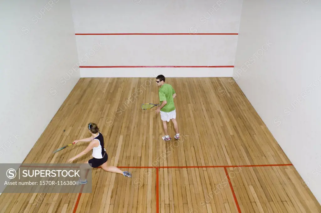 High angle view of two people playing squash