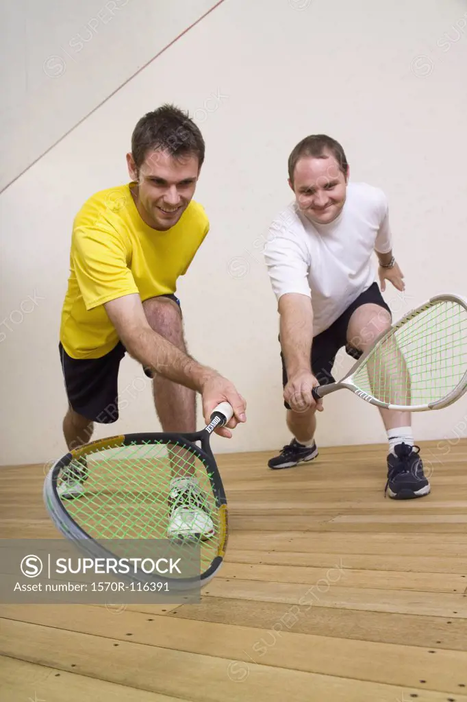Two men playing squash