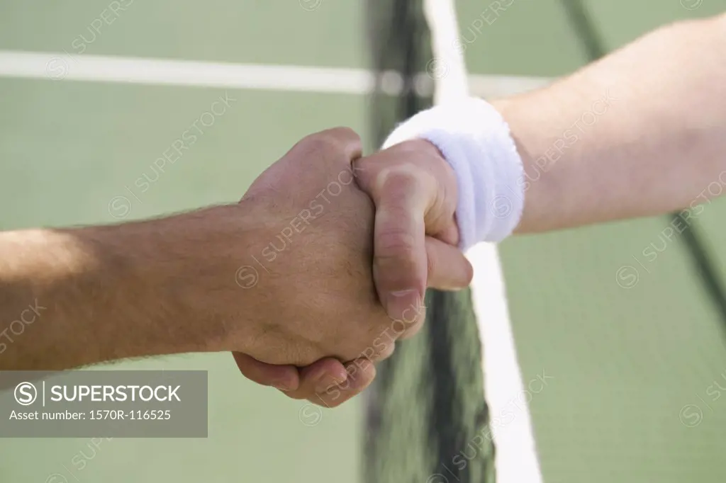 Two tennis players shaking hands