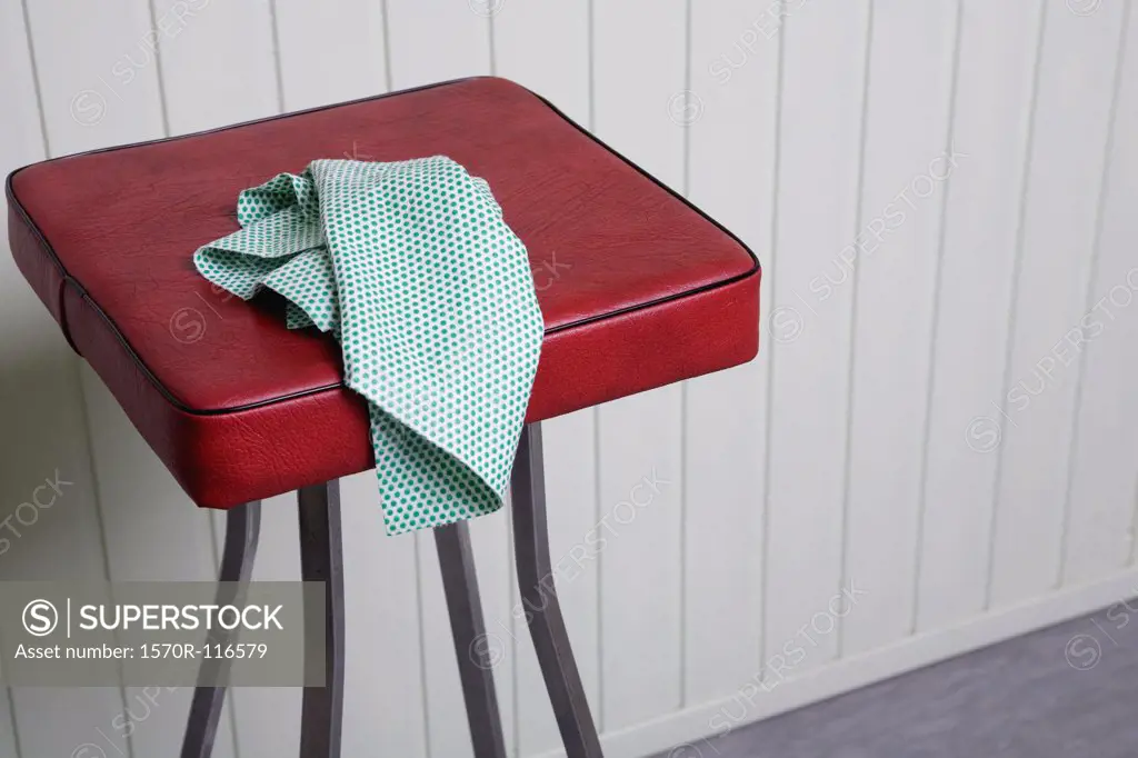 A cleaning cloth on a stool
