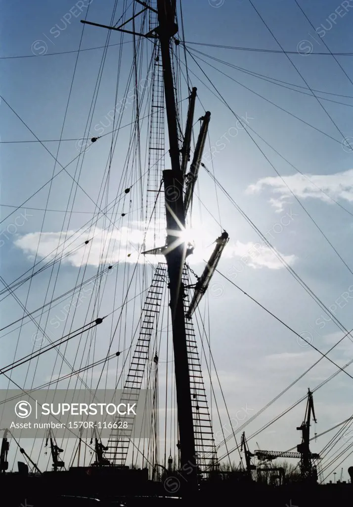 Ship's mast and rigging in silhouette