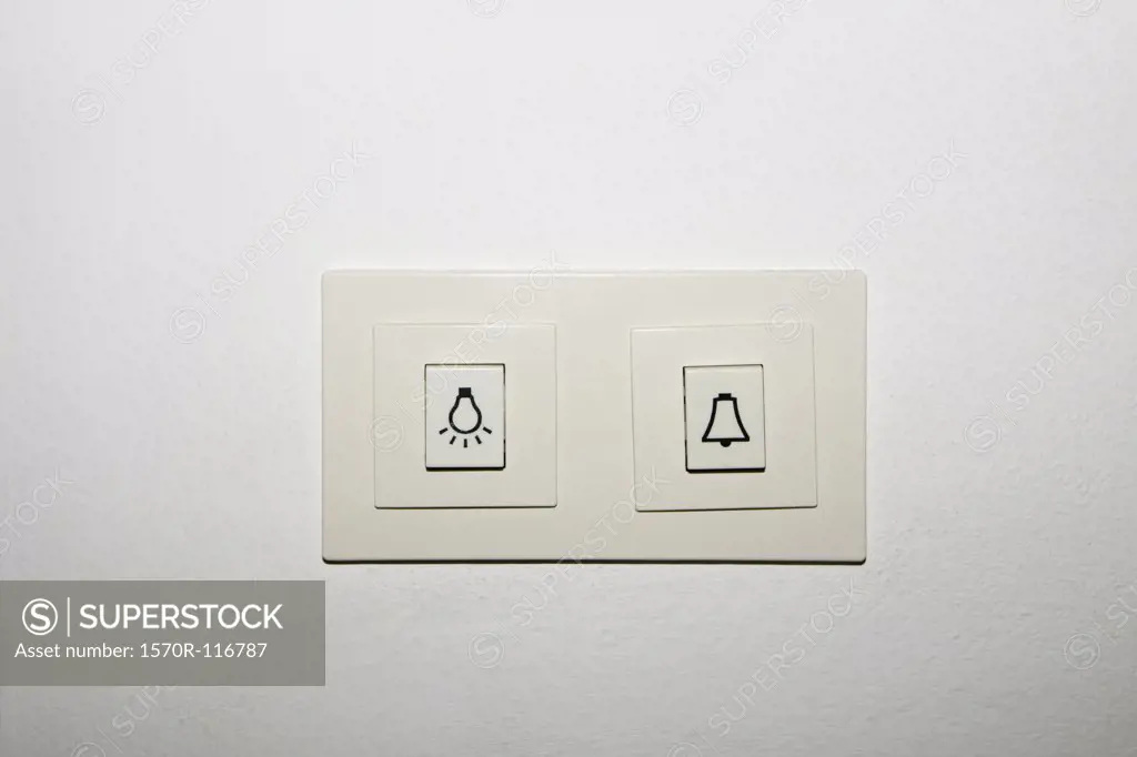 A light switch and a door bell