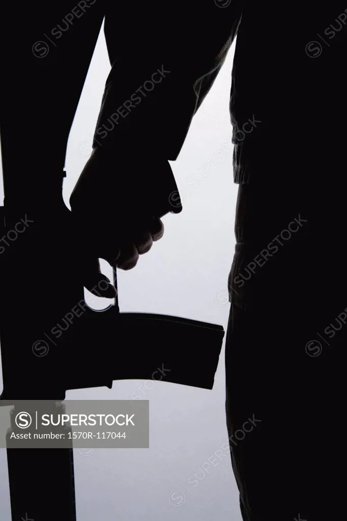 Silhouette of a soldier holding a gun