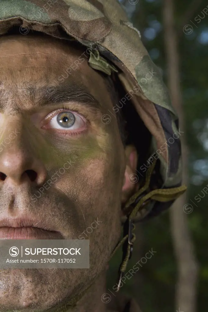 Portrait of a soldier wearing camouflage face paint