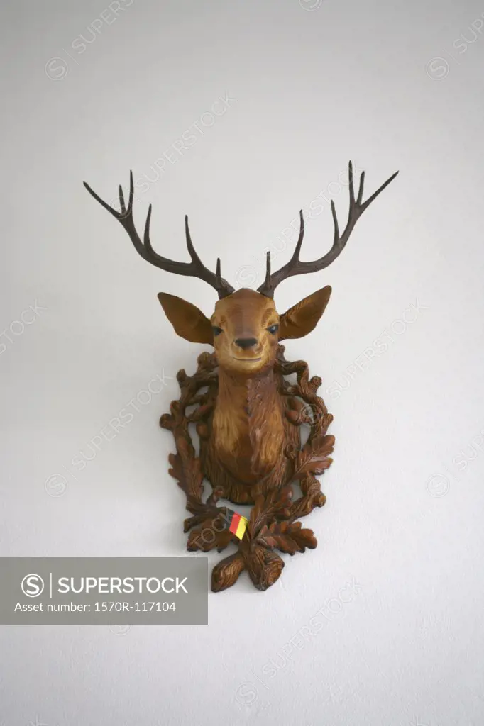 A plastic deer head on a wall